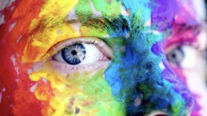 Male Face Painted with Multi-Colors