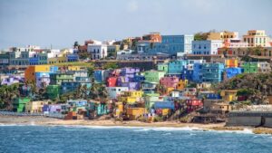 Colorful houses line the hillside over looking the beach in San Juan, Puerto Rico